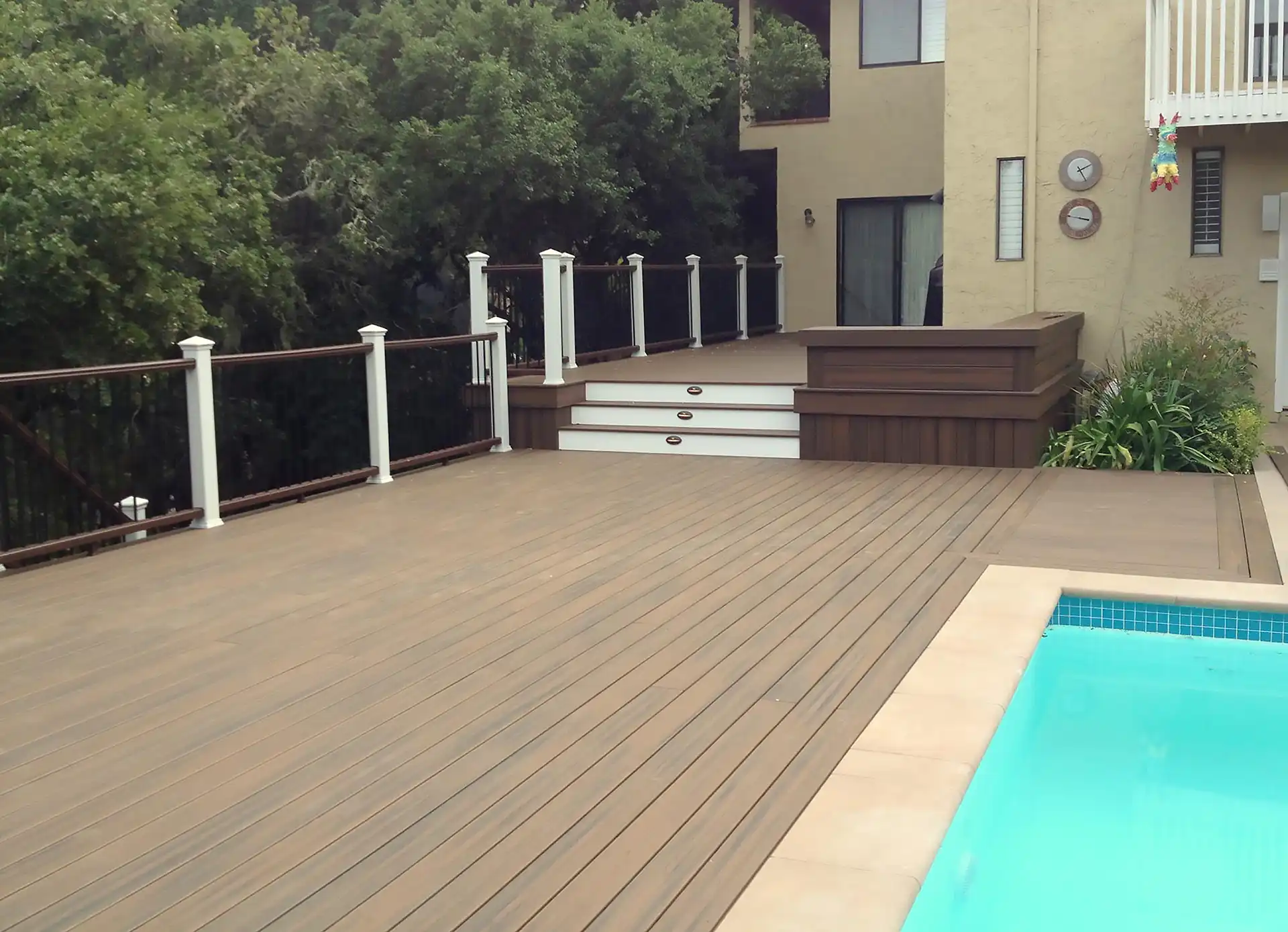 photo of a composite deck with cable railing and deck steps - Composite Deck Builders in Hillsborough CA