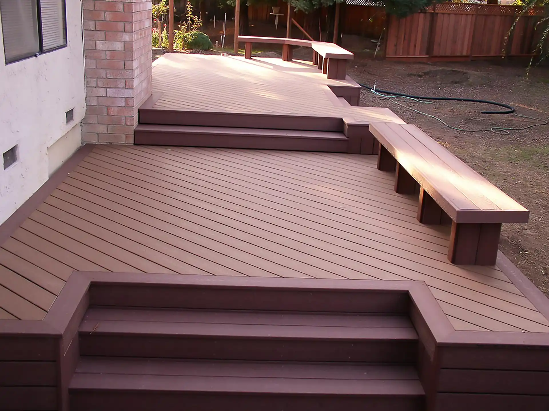 photo of a multi-level deck with built-in benches