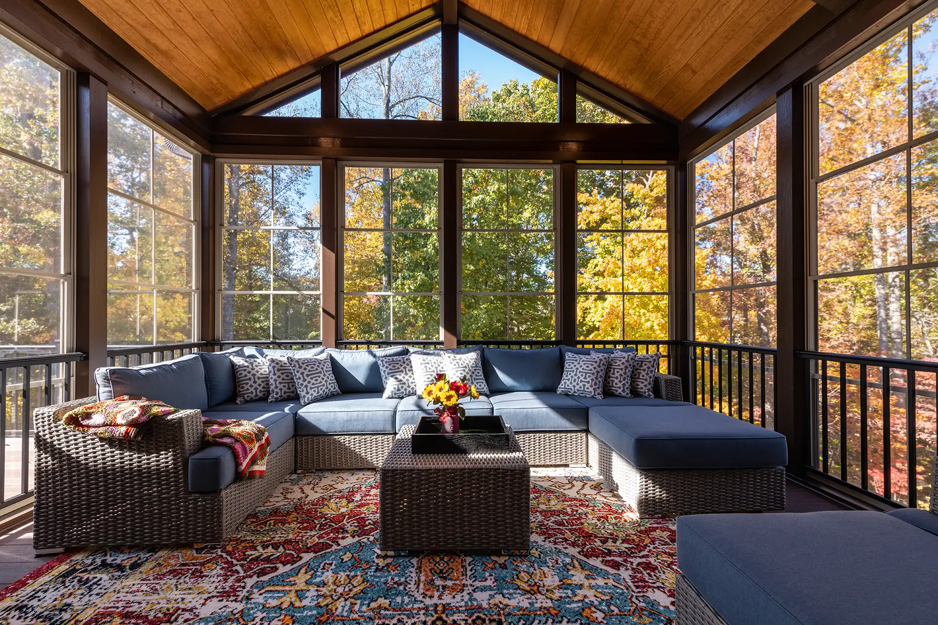 photo of an outdoor room, a three-season room with outdoor furniture