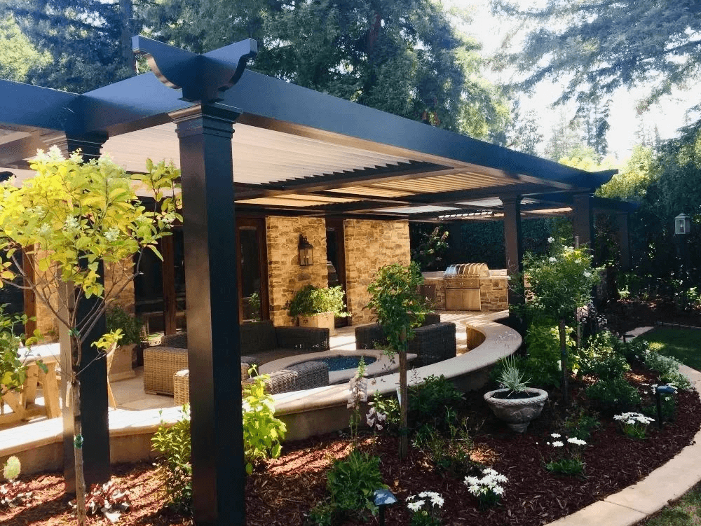 photo of a StruXure pergola and patio with outdoor kitchen and plants