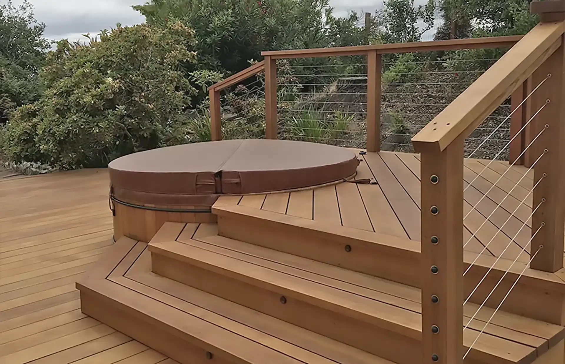 multi-level deck with a partial surround for a hot tub